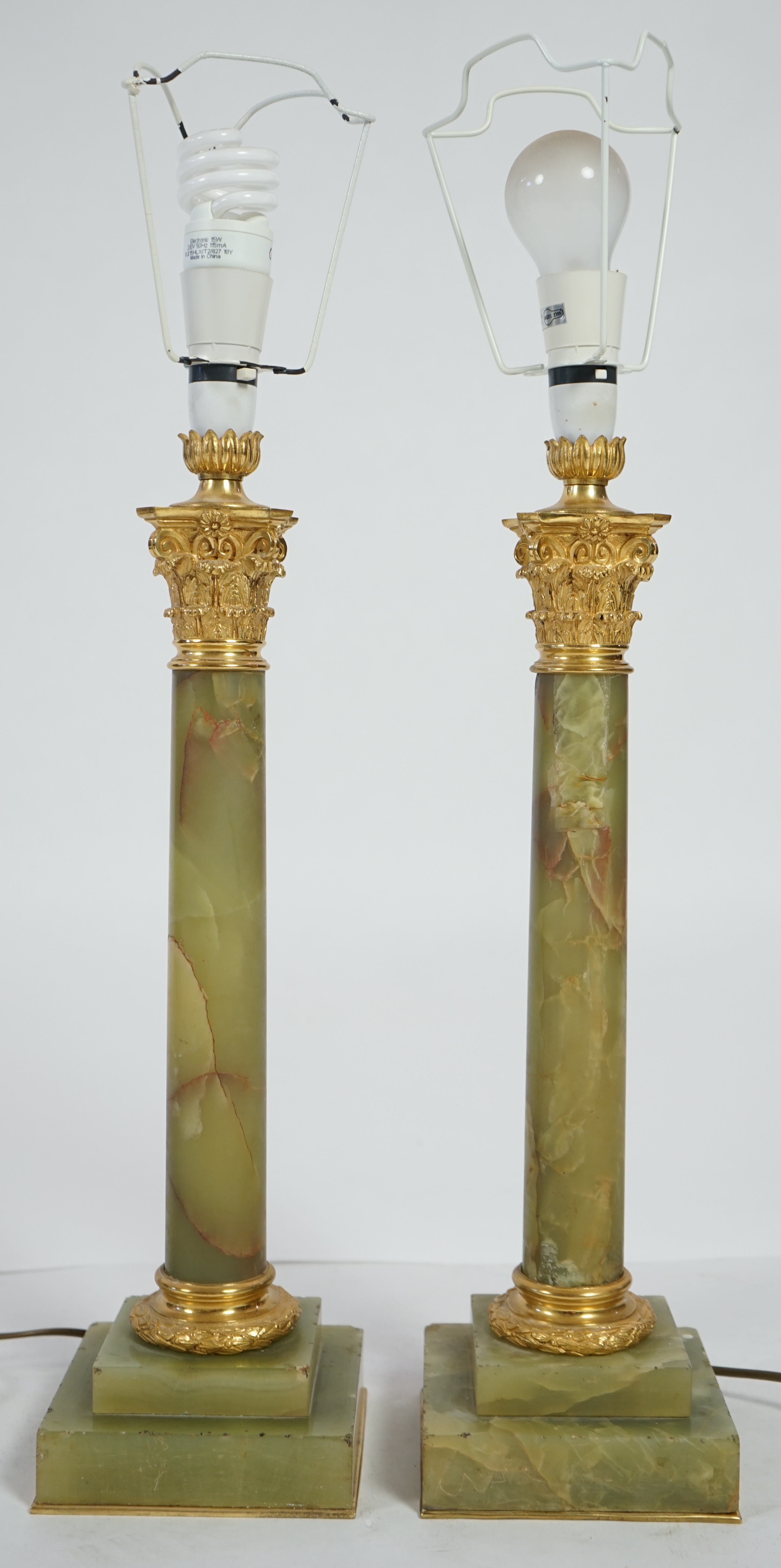 A pair of Victorian ormolu mounted green onyx table lamps